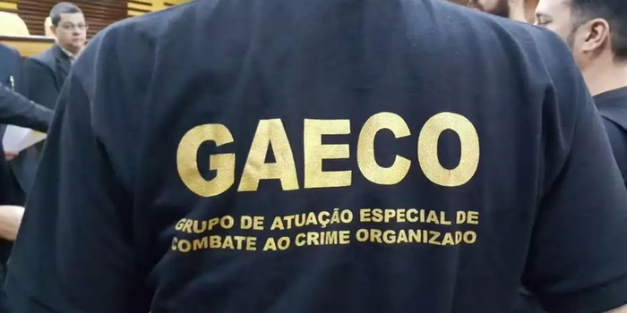 MPRJ denuncia 20 pessoas por suposta ligação com a milícia de Curicica e o TCP. Dois policiais militares estão entre os investigados.
